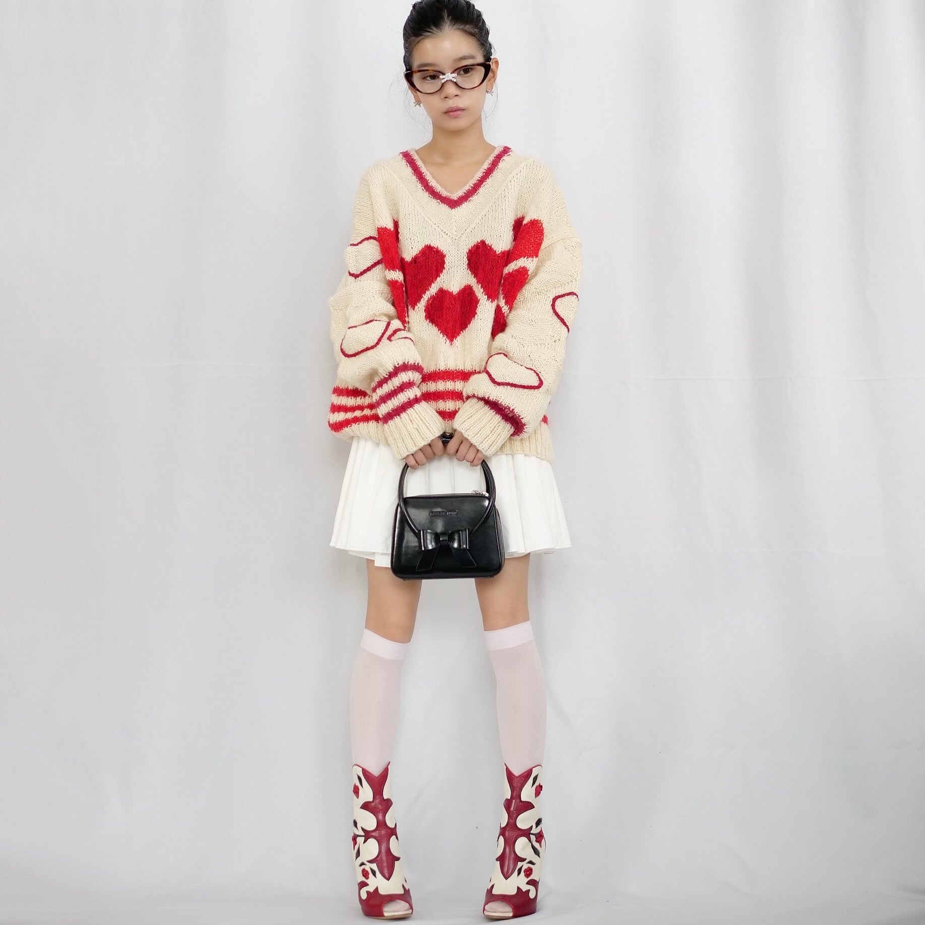 Hand-knitted sweater with lots hearts