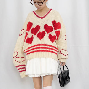 Hand-knitted sweater with lots hearts