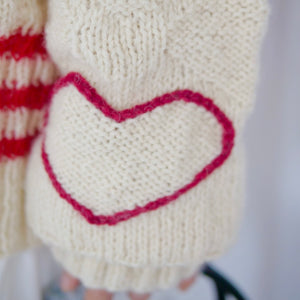 Hand-knitted sweater with lots hearts