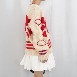 Hand-knitted sweater with lots hearts